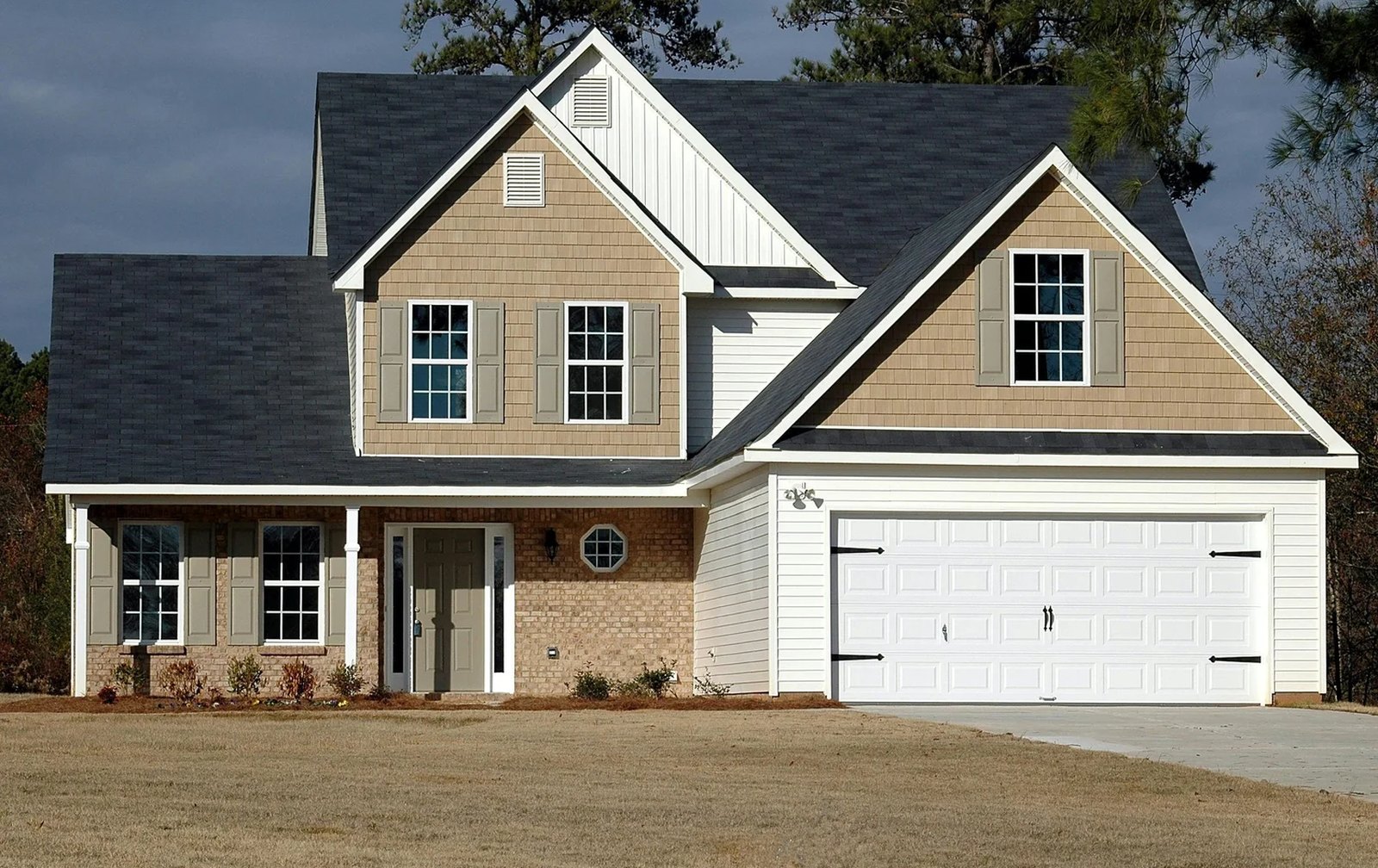 Home with a white double garage door installed by A2Z Garage Doors